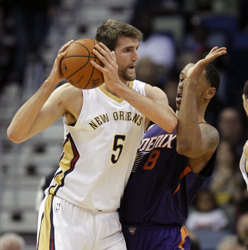 New Orleans Pelicans center Jeff Withey (5) tries to get around Phoenix Suns forward Channing Frye (8) in the first half of an NBA basketball game in New Orleans, Wednesday, April 9, 2014. (AP Photo/Bill Haber)