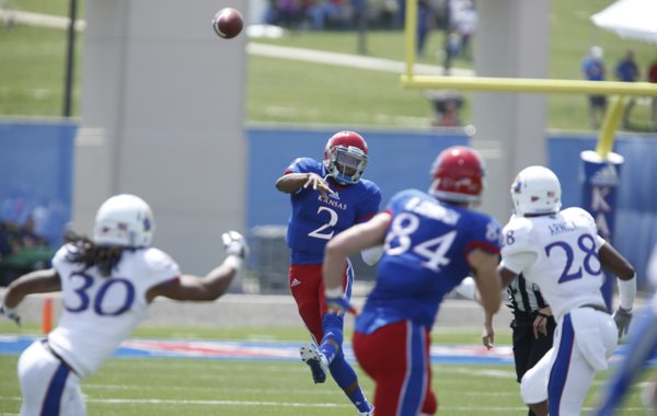 Blue Team quarterback Montell Cozart throws against the White Team during the first half of the Kansas Spring Game on Saturday, April 12, 2014 at Memorial Stadium. Nick Krug/Journal-World Photo