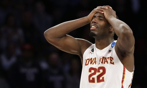 Iowa State's Dustin Hogue reacts to Iowa State's 81-76 loss to Connecticut in a regional semifinal of the NCAA men's college basketball tournament Friday, March 28, 2014, in New York. (AP Photo/Seth Wenig)