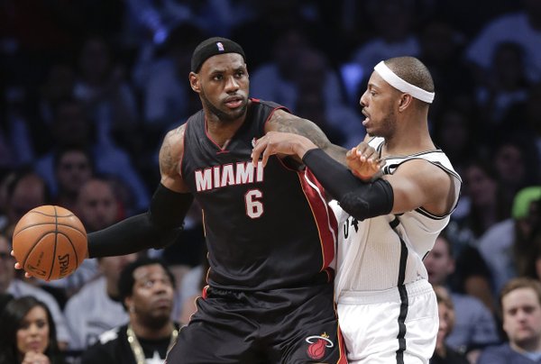 Miami Heat forward LeBron James (6) looks to drive against Brooklyn Nets forward Paul Pierce (34) in the third period during Game 3 of an Eastern Conference semifinal NBA playoff basketball game, Saturday, May 10, 2014, in New York. The Nets won 104-90. (AP Photo/Julie Jacobson)