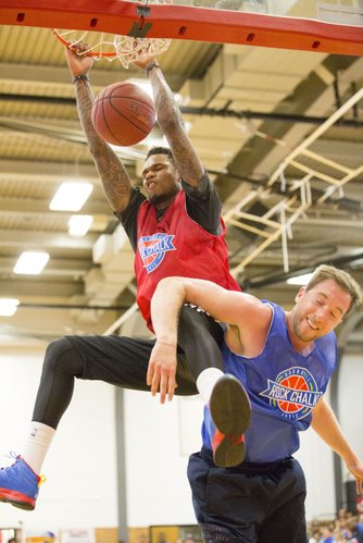 Ben McLemore brings down the house as he slams home a monstrous dunk over Brady Morningstar during the annual Rock Chalk Roundball Classic, played Thursday evening at Lawrence High.