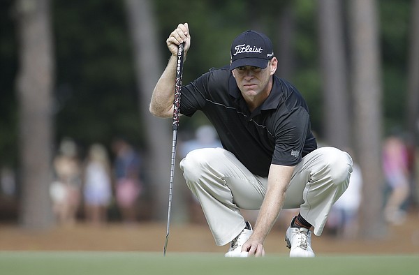 Chris Thompson lines up a putts on the 12th hole during the second round of the U.S. Open golf tournament in Pinehurst, N.C., Friday, June 13, 2014.
