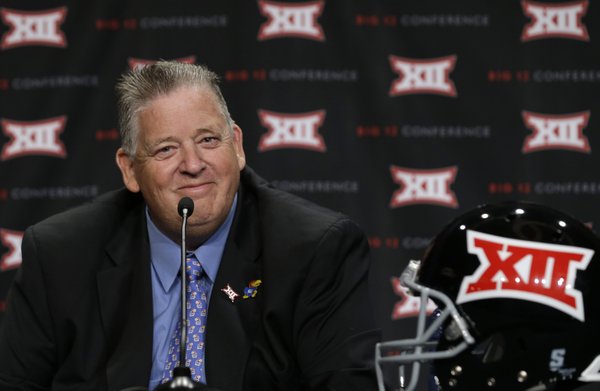 Kansas head coach Charlie Weis smiles during during the NCAA college Big 12 Conference Football Media Days in Dallas, Monday, July 21, 2014. (AP Photo/LM Otero)