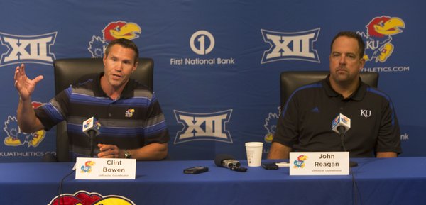 Defensive coordinator Clint Bowen and offensive coordinator John Reagan field questions from the media to open Kansas University's 2014 fall football camp on Thursday August 7, 2014.