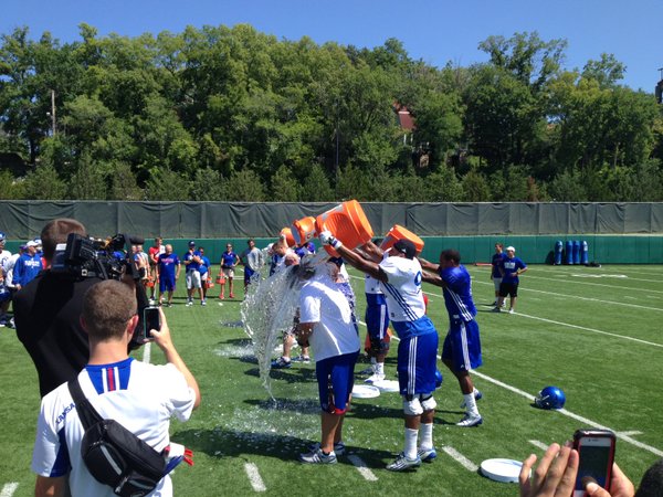 More KU staff members took the ALS Ice Bucket Challenge to jumpstart practice Monday at the KU practice fields. 