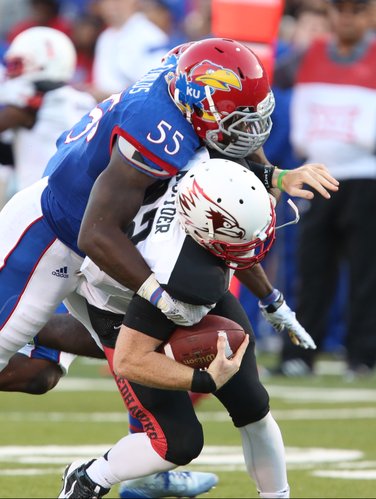 Kansas buck Michael Reynolds drops Southeast Missouri State quarterback Kyle Snyder for a loss during the first quarter on Saturday, Sept. 6, 2014 at Memorial Stadium.