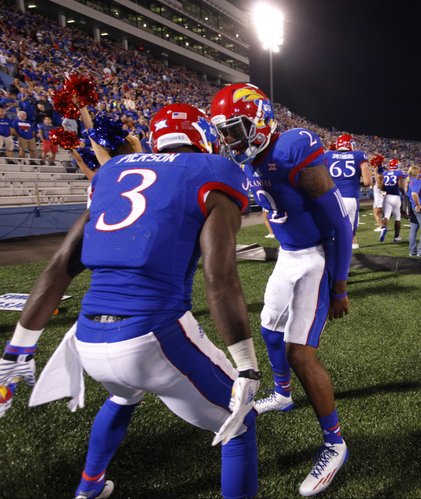 Kansas quarterback Montell Cozart celebrates with receiver Tony Pierson after the two connected for a touchdown against Southeast Missouri State during the third quarter on Saturday, Sept. 6, 2014 at Memorial Stadium.