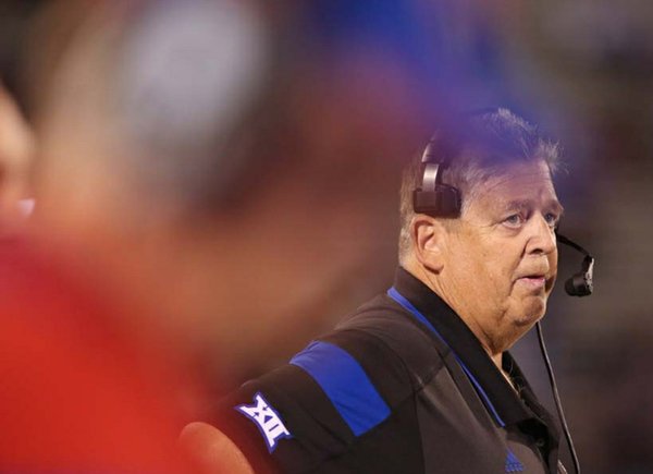 Kansas head coach Charlie Weis watches the video board after a late fourth-quarter touchdown by Southeast Missouri State on Saturday, Sept. 6, 2014 at Memorial Stadium.