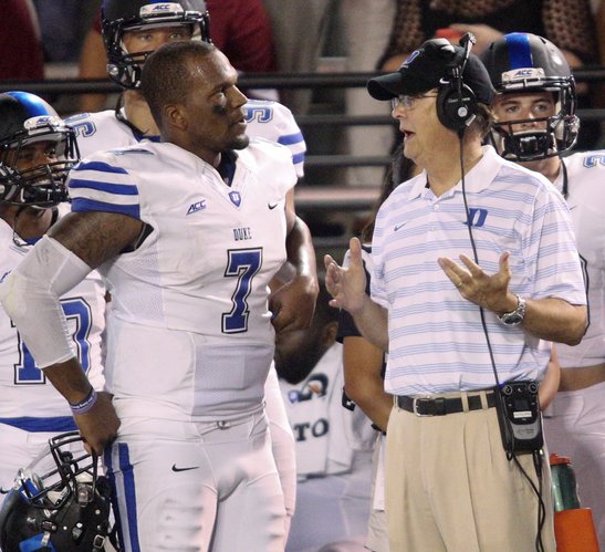Duke Head Coach David Cutcliffe talks with quarterback Anthony Boone (7) in the second half of an NCAA college football game at Veterans Memorial Stadium, Saturday, Sept. 6, 2014, in Troy, Ala. (AP Photo/ Hal Yeager)
