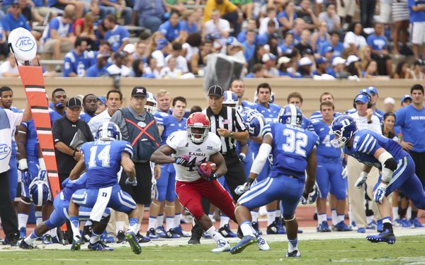 Kansas tight end Jimmay Mundine has nowhere to go as he is surrounded by several Duke defenders during the second quarter on Saturday, Sept. 13, 2013 at Wallace Wade Stadium in Durham, North Carolina.