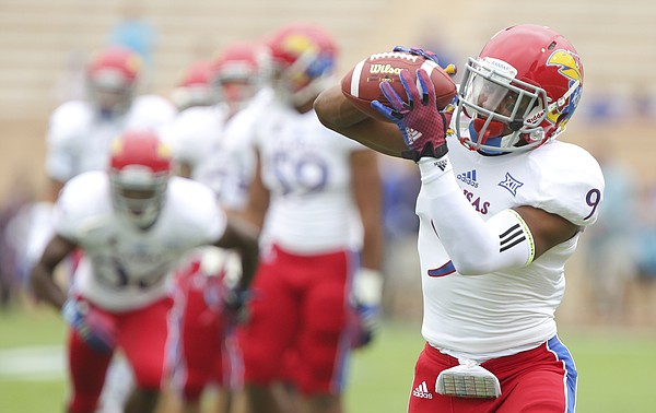 Kansas safety Fish Smithson catches a pass during warmups prior to the Jayhawks' kickoff against Duke on Saturday, Sept. 13, 2014, at Wallace Wade Stadium in Durham, North Carolina.