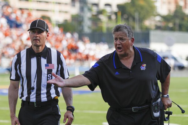 Kansas head coach Charlie Weis lays into a game official for what he believes was a missed call during the second quarter on Saturday, Sept. 27, 2014 at Memorial Stadium.
