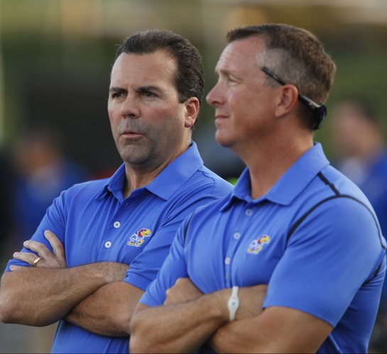 Kansas University director of athletics Sheahon Zenger, left, watches from the sideline next to deputy athletics director Sean Lester during the final minutes on Saturday, Sept. 27, 2014 at Memorial Stadium.