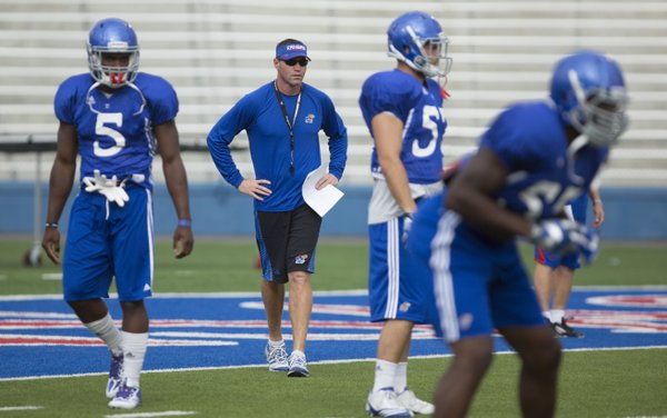 Kansas interim head football coach Clint Bowen watches over the defense during practice on Wednesday, Oct. 1, 2014.