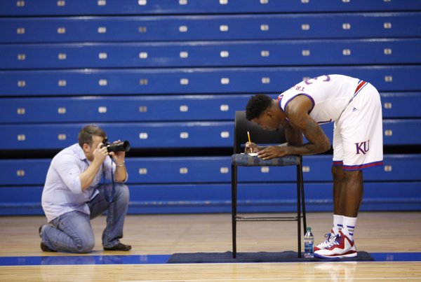 Kansas forward Jamari Traylor is photographed while filling out a humorous list of questions during Kansas basketball Media Day on Thursday, Oct. 1, 2014.