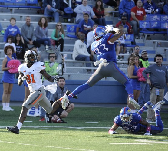 Kansas senior safety Cassius Sendish intercepts a pass early in the 2nd half of the Jayhawks 27-20 loss to Oklahoma State Saturday afternoon. The play was one of two turnovers forced by Kansas on the day.