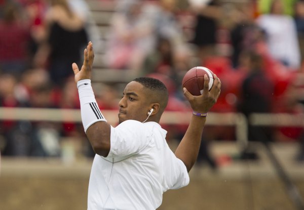 Kansas quarterback Michael Cummings throws the ball around prior to kickoff against Texas Tech on Saturday, Oct. 18, 2014 at Jones AT&T Stadium in Lubbock, Texas.