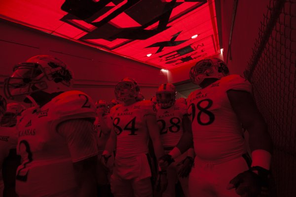 The Kansas Jayhawks get fired up in the tunnel prior to kickoff against Texas Tech on Saturday, Oct. 18, 2014 at Jones AT&T Stadium in Lubbock, Texas.