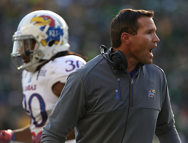 Kansas head coach Clint Bowen tries to keep his defense fired up after a Baylor score during the second quarter at McLane Stadium on Saturday, Nov. 1, 2014 in Waco, Texas.