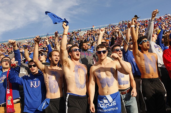 A line of Kansas students painted with letters spelling out "Bowen" cheer during a kickoff after Kansas touchdown against Iowa State during the first quarter on Saturday, Nov. 8, 2014.