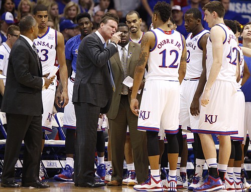 Kansas head coach Bill Self has words for Kelly Oubre during a team huddle during the first half on Tuesday, Nov. 11, 2014.