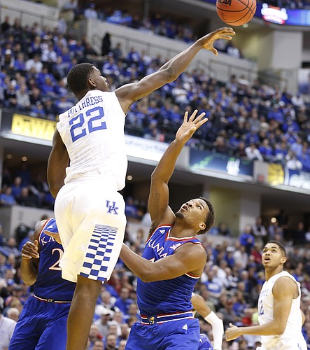 Kansas guard Wayne Selden Jr. (1) watches as Kentucky forward Alex Poythress (22) rejects his floater during the second half of the Champions Classic on Tuesday, Nov. 18, 2014 at Bankers Life Fieldhouse in Indianapolis.