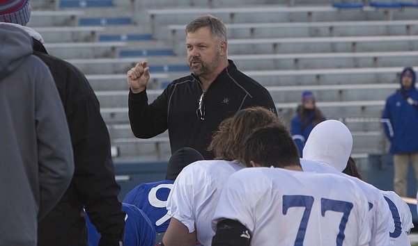 Former KU standout center Chip Budde was on hand at Wednesday's KU football practice to give a pep talk to players as the Jayhawks prepare to travel to Oklahoma to play the Sooners.