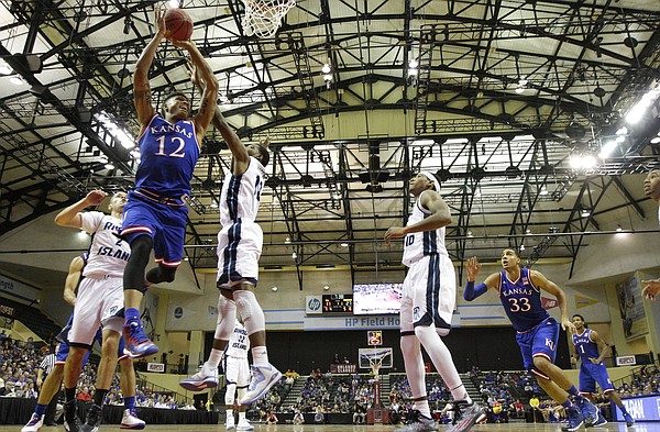 Kansas guard Kelly Oubre gets to the bucket against the Rhode Island defense during the first half on Thursday, Nov. 27, 2014 at the HP Field House in Kissimmee, Florida.