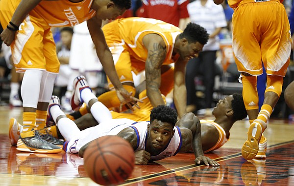 Tennessee players celebrate  a charge from Kansas forward Jamari Traylor during the second half on Friday, Nov. 28, 2014 at the HP Field House in Kissimmee, Florida.