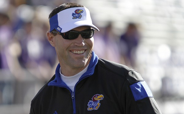 KU interim head football coach, Clint Bowen, watches the Jayhawks during drills before the game against the Kansas State Wildcats in Manhattan. 
