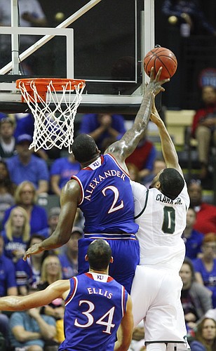 Kansas forward Cliff Alexander (2) rejects a shot from Michigan State forward Marvin Clark Jr. (0) during the first half on Sunday, Nov. 30, 2014 at the HP Field House in Kissimmee, Florida.
