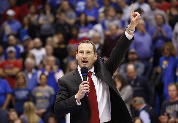 Newly-hired Kansas head football coach David Beaty is introduced to the Allen Fieldhouse crowd during halftime of the JayhawksÕ game against Floriday on Friday, Dec. 5, 2014. Beaty is the 38th head coach in the programÕs history.