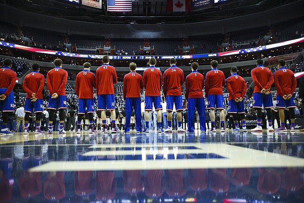 The Jayhawks stand for the National Anthem prior to tipoff against Georgetown on Wednesday, Dec. 10, 2014 at Verizon Center in Washington D.C.