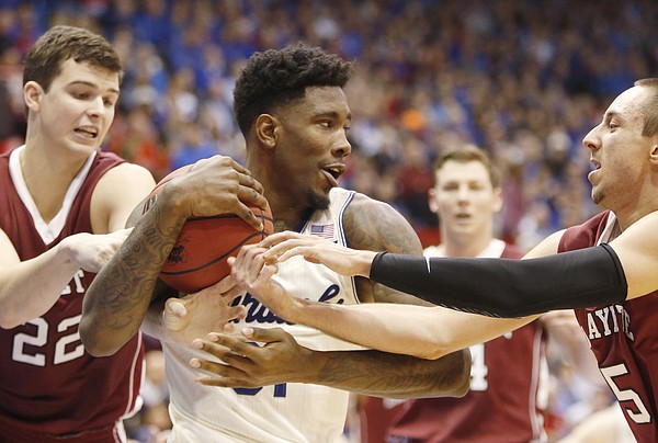 Kansas forward Jamari Traylor (31) gets wrapped up by  Leopards defenders in KU's 96-69 win against Lafayette Saturday, Dec. 20, 2014 at Allen Fieldhouse.