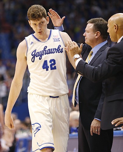 Kansas center Hunter Mickelson is congratulated by coach Bill Self during KU's 96-69 win over the Lafayette Leopards Saturday, Dec. 20, 2014 at Allen Fieldhouse.