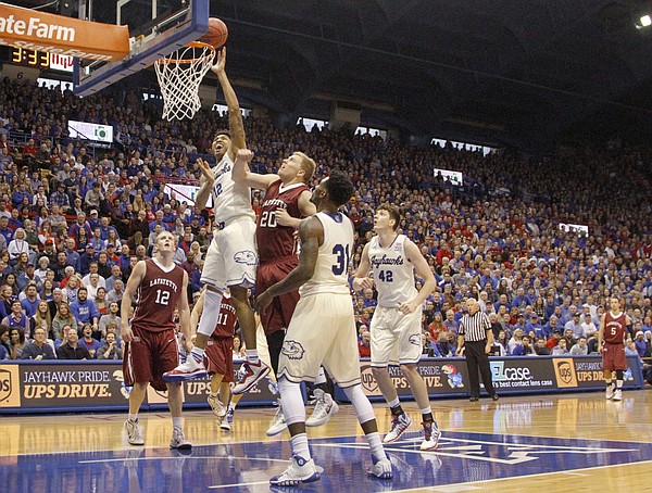Kansas guard Kelly Oubre, Jr. (12) puts up a basket in the Jayhawk's 96-69 win over the Lafayette Leopards Saturday, Dec. 20, 2014.