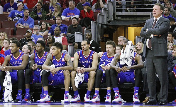 Kansas coach Bill Self and members of the team watch in the closing minutes of a 77-52 loss to the Temple Owls Monday at the Wells Fargo Center in Philadelphia, PA.
