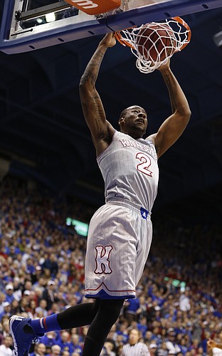 Kansas forward Cliff Alexander (2) delivers a dunk on a lob pass during the second half on Tuesday, Dec. 30, 2014 at Allen Fieldhouse.