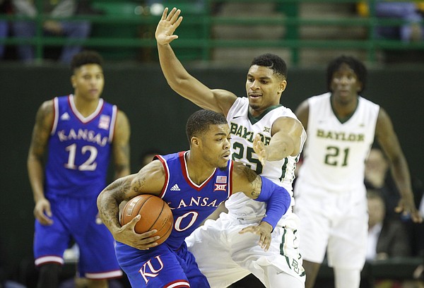 Kansas guard Frank Mason III (0) is hounded by Baylor guard Al Freeman (25) during the first half on Wednesday, Jan. 7, 2014 at Ferrell Center in Waco, Texas.