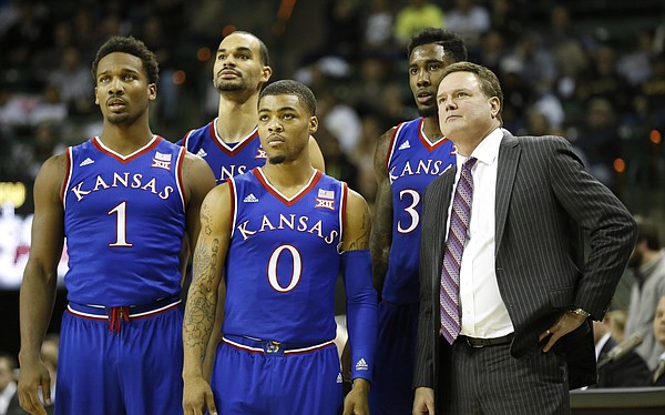 Kansas players, from left, Wayne Selden, Perry Ellis, Frank Mason and Jamari Traylor watch a pair of free throws from Kelly Oubre with head coach Bill Self after a flagrant foul by Baylor during the second half on Wednesday, Jan. 7, 2014 at Ferrell Center in Waco, Texas.