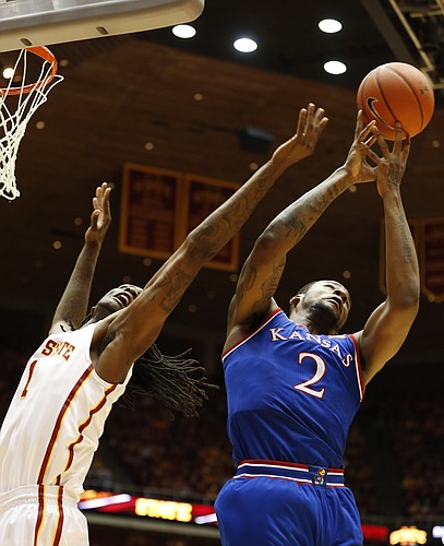 Kansas forward Cliff Alexander (2) fights for a rebound with Iowa State forward Jameel McKay (1) during the first half on Saturday, Jan. 17, 2015 at Hilton Coliseum.