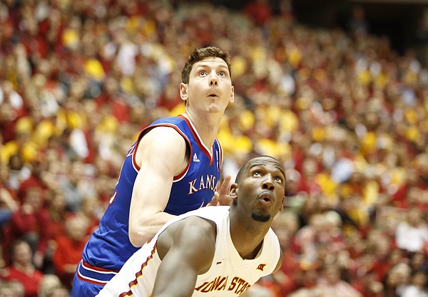 Kansas forward Hunter Mickelson and Iowa State forward Dustin Hogue await a rebound during the second half on Saturday, Jan. 17, 2015 at Hilton Coliseum.