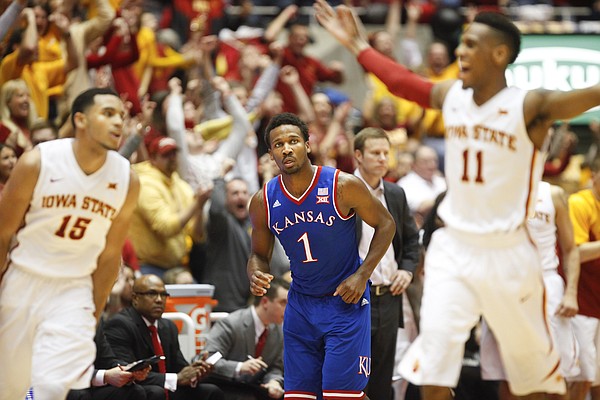 Kansas guard Wayne Selden Jr. (1) casts a stunned expression as Iowa State players and fans celebrate a three by the Cyclones during the second half on Saturday, Jan. 17, 2015 at Hilton Coliseum.