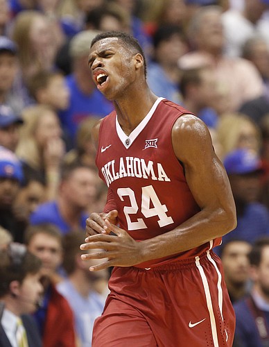 Oklahoma guard Buddy Hield (24) celebrates during the Sooners' comeback against Kansas during the second half on Monday, Jan. 19, 2015 at Allen Fieldhouse.