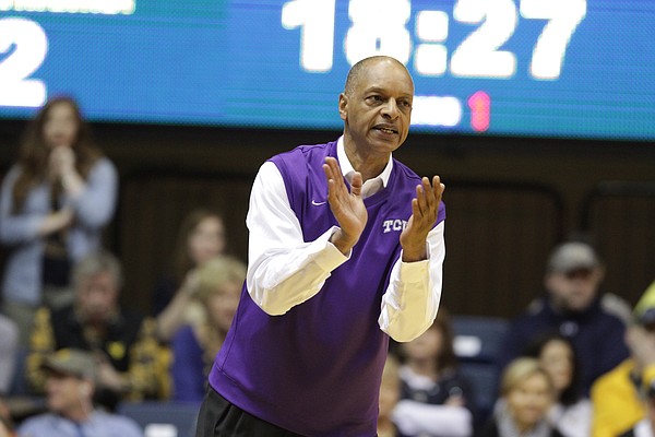 TCU head coach Trent Johnson encourages his players during the first half of an NCAA college basketball game against West Virginia, Saturday, Jan. 24, 2015, in Morgantown, W.Va. West Virginia defeated TCU 86-85 in overtime.