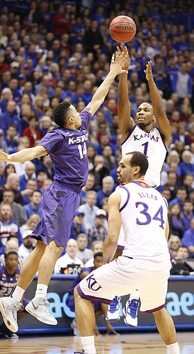 Kansas guard Wayne Selden Jr. (1) pulls up for a three pointer against Kansas State guard Justin Edwards (14) during the first half on Saturday, Jan. 31, 2015 at Allen Fieldhouse.