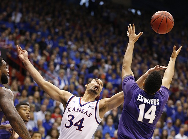 Kansas forward Perry Ellis (34) battles for a rebound with Kansas State guard Justin Edwards (14) during the first half on Saturday, Jan. 31, 2015 at Allen Fieldhouse.