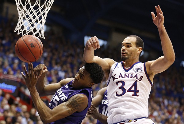 Kansas forward Perry Ellis (34) fights for a rebound with Kansas State forward Wesley Iwundu (25) during the second half on Saturday, Jan. 31, 2015 at Allen Fieldhouse.