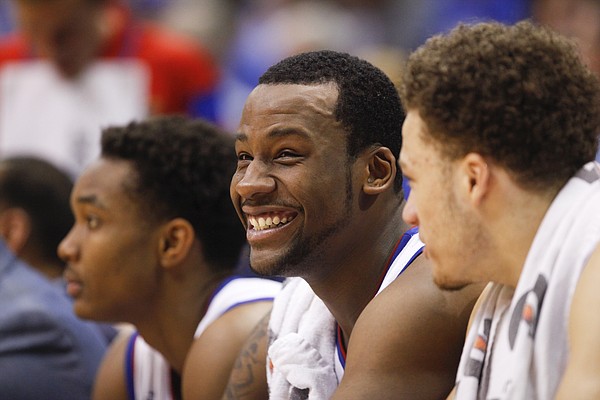 Kansas forward Cliff Alexander flashes a smile on the bench with his teammates during the second half on Saturday, Jan. 31, 2015 at Allen Fieldhouse.