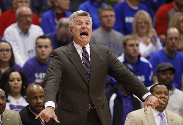 Kansas State head coach Bruce Weber looks to grab his players attention during the first half on Saturday, Jan. 31, 2015 at Allen Fieldhouse.